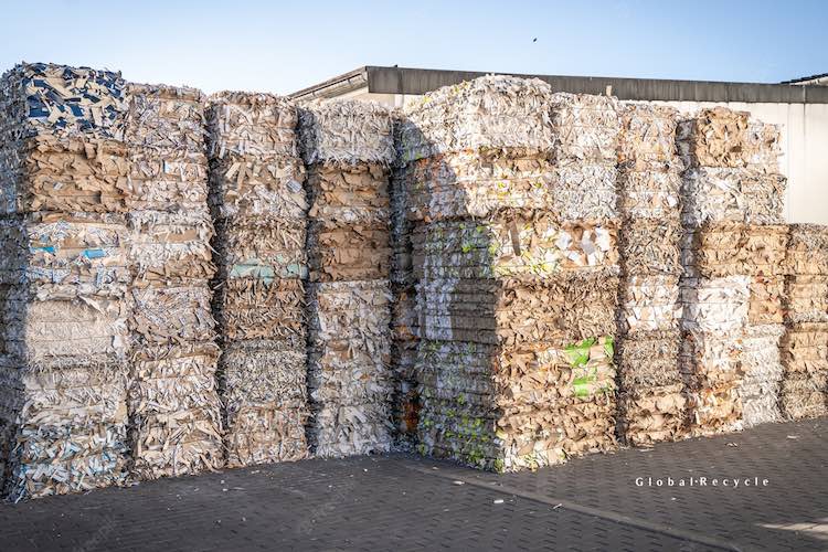 Stacked bales of recycled cardboard